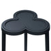 Navy blue side table with a clover shape on a white background