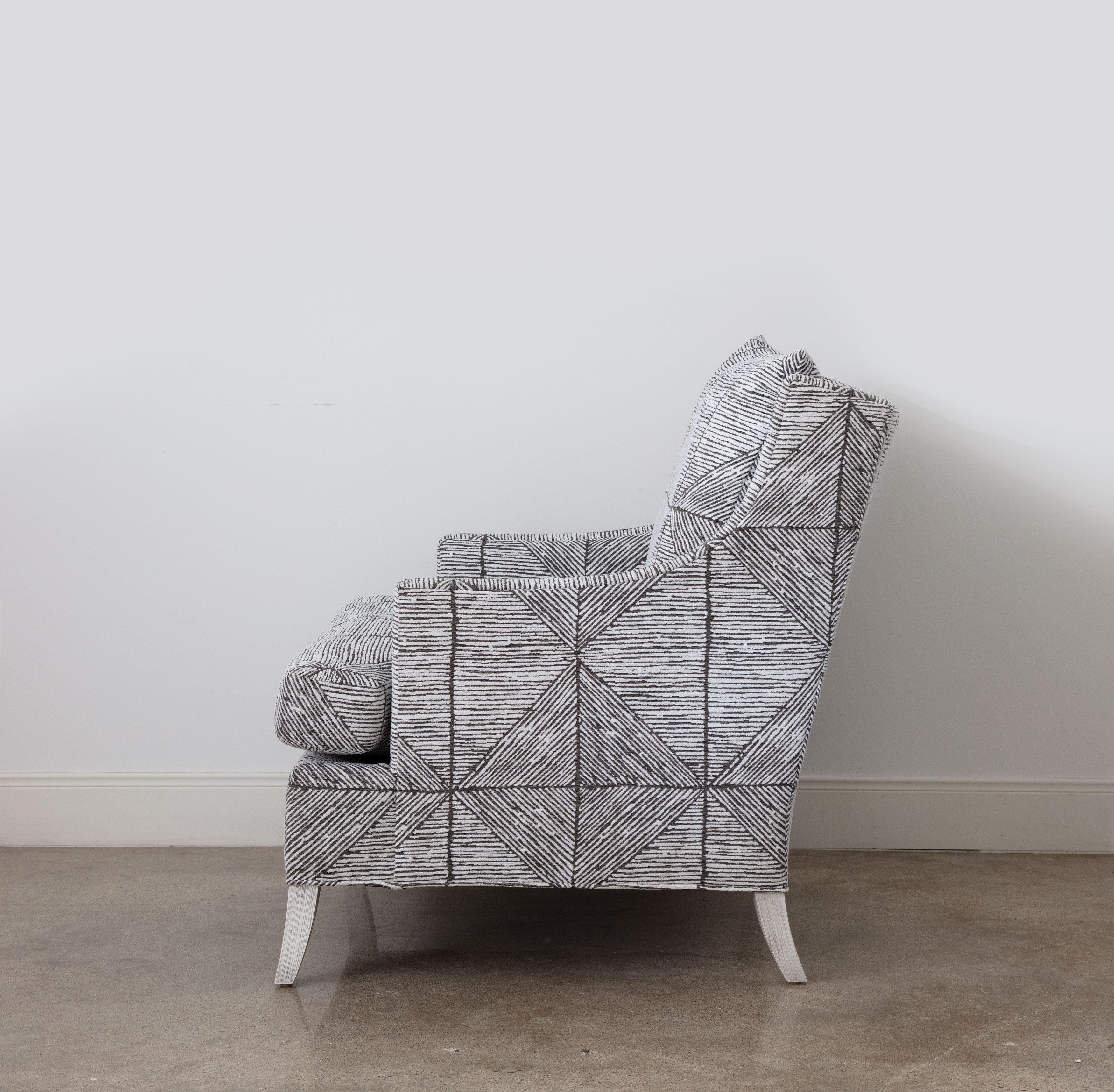 side view of graphic-print brown and white chair