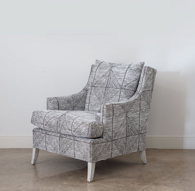brown and white arm chair with white legs