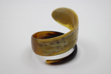 Horn cuff bracelet on a white background