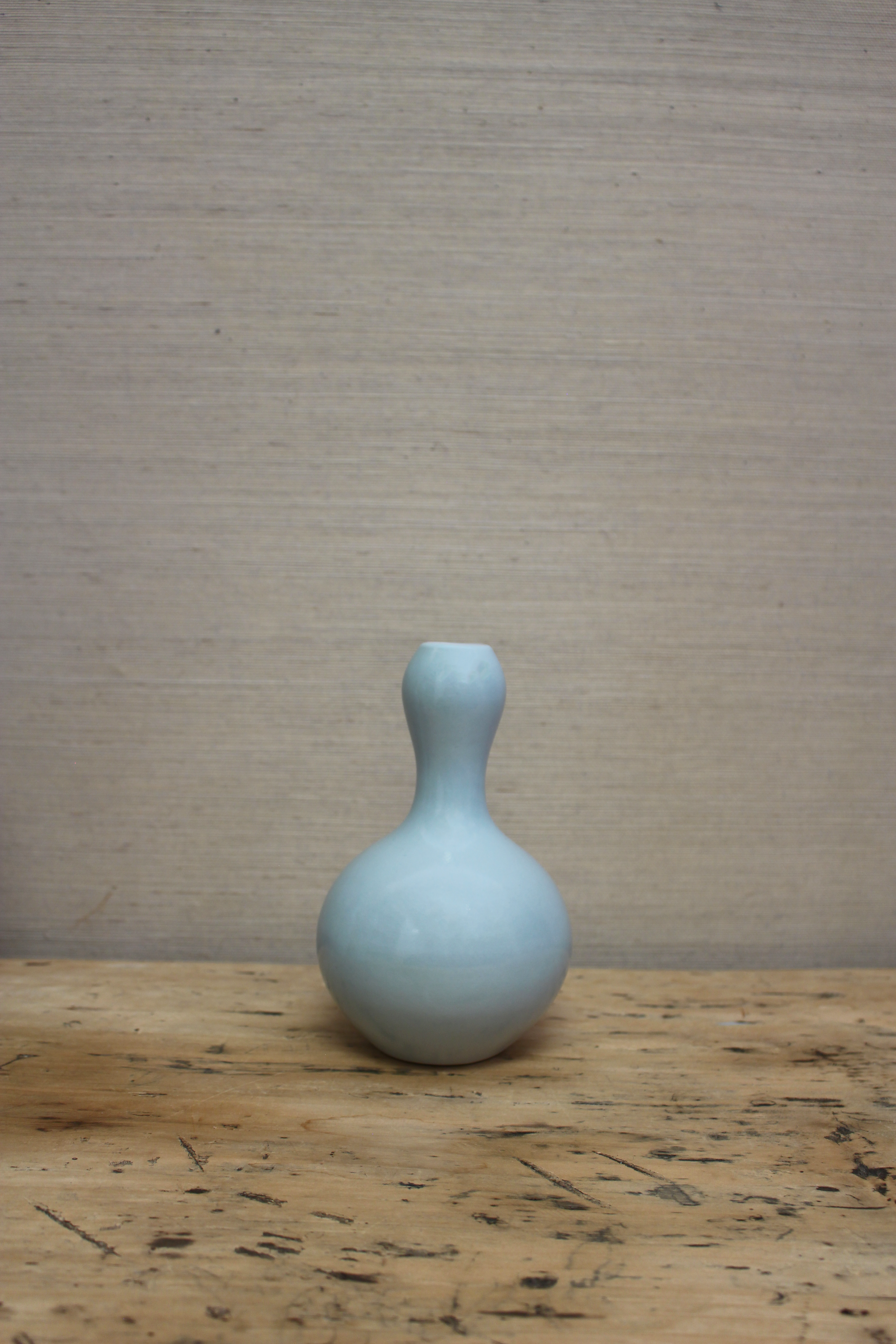 small icy blue bulbous vase
