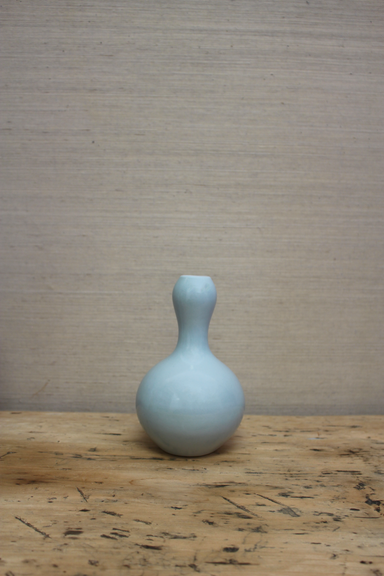 small icy blue bulbous vase