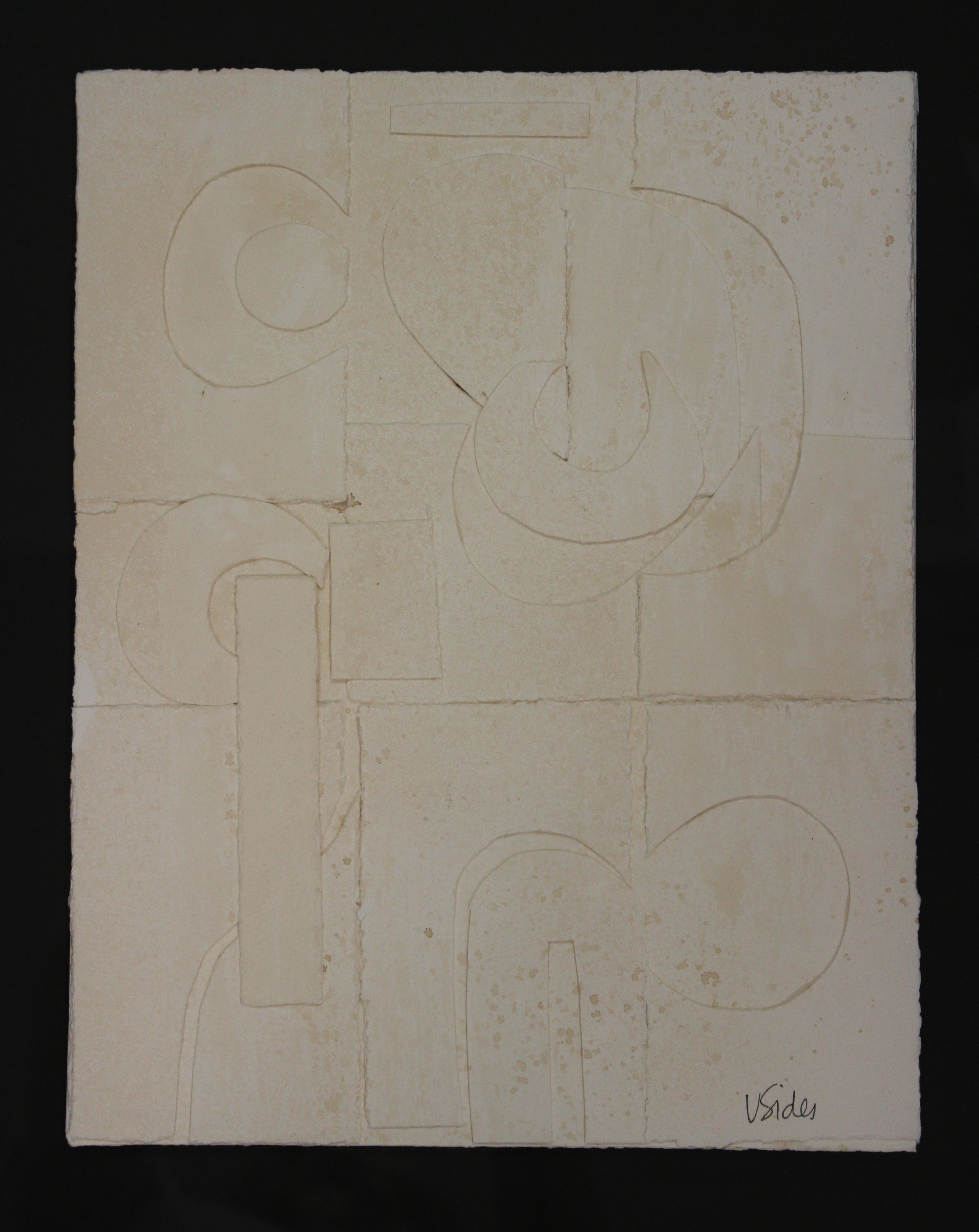 Abstract artwork with geometric shapes on a textured beige surface
