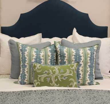 pillow arrangement with blue headboard