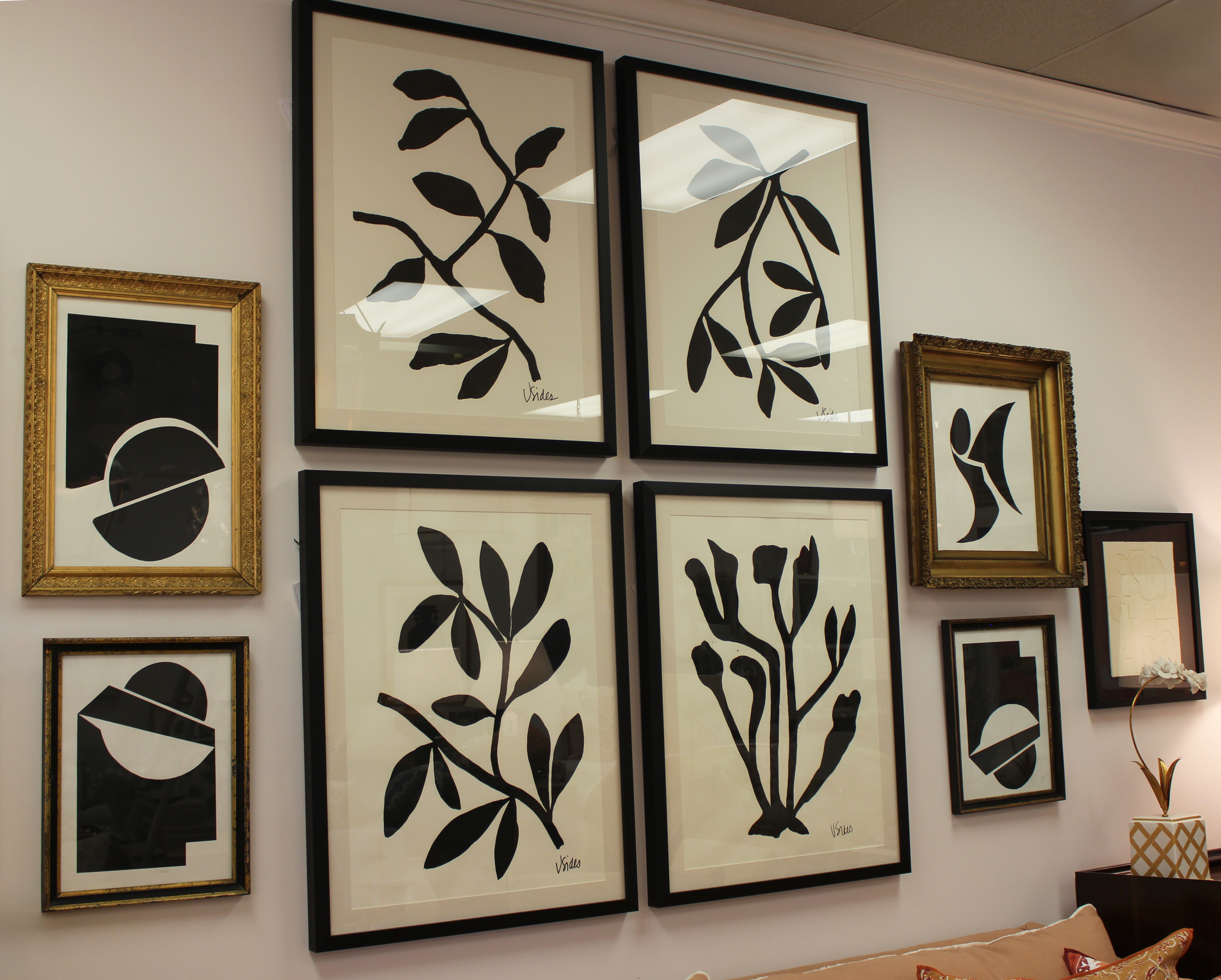 Wall with framed black and white abstract art pieces