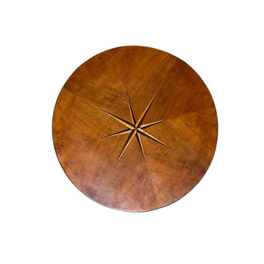 star inlay on top of antique Italian table