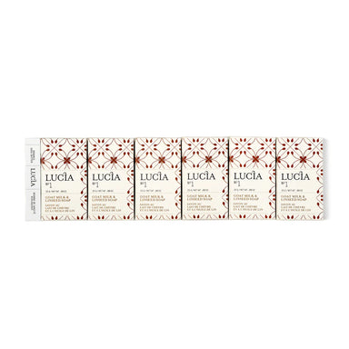 Lucia soap bars with decorative packaging on a white background