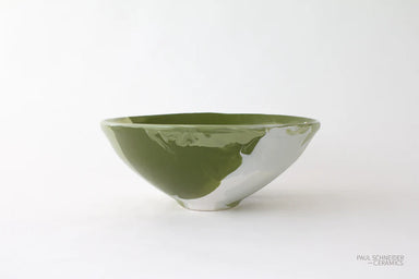 Green ceramic bowl on a white background