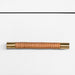 Cabinet handle with woven design and gold accents on a white background