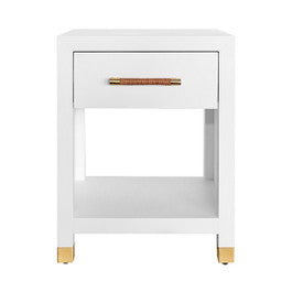A modern white nightstand with a single drawer, open lower shelf, and small gold-toned legs and handle, shown on a plain white background.