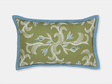 embroidered green pillow with blue flange