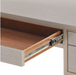 inside view of desk drawer showing stained interior and glide closure