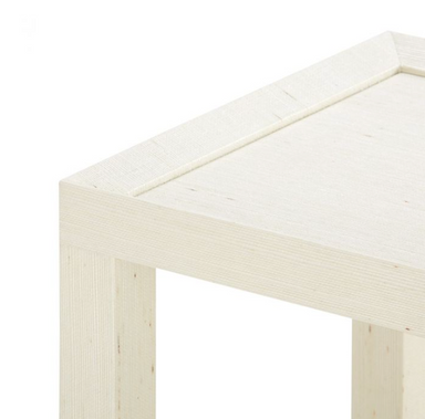 corner detail of cream grasscloth tea table