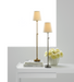 stick-style brass and nickel lamps on white console table