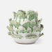 white and green artichoke-like ceramic vase