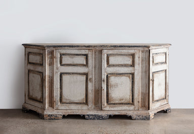 antique credenza with faded white and black paint