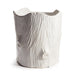 White ceramic vase with textured surface on a white background