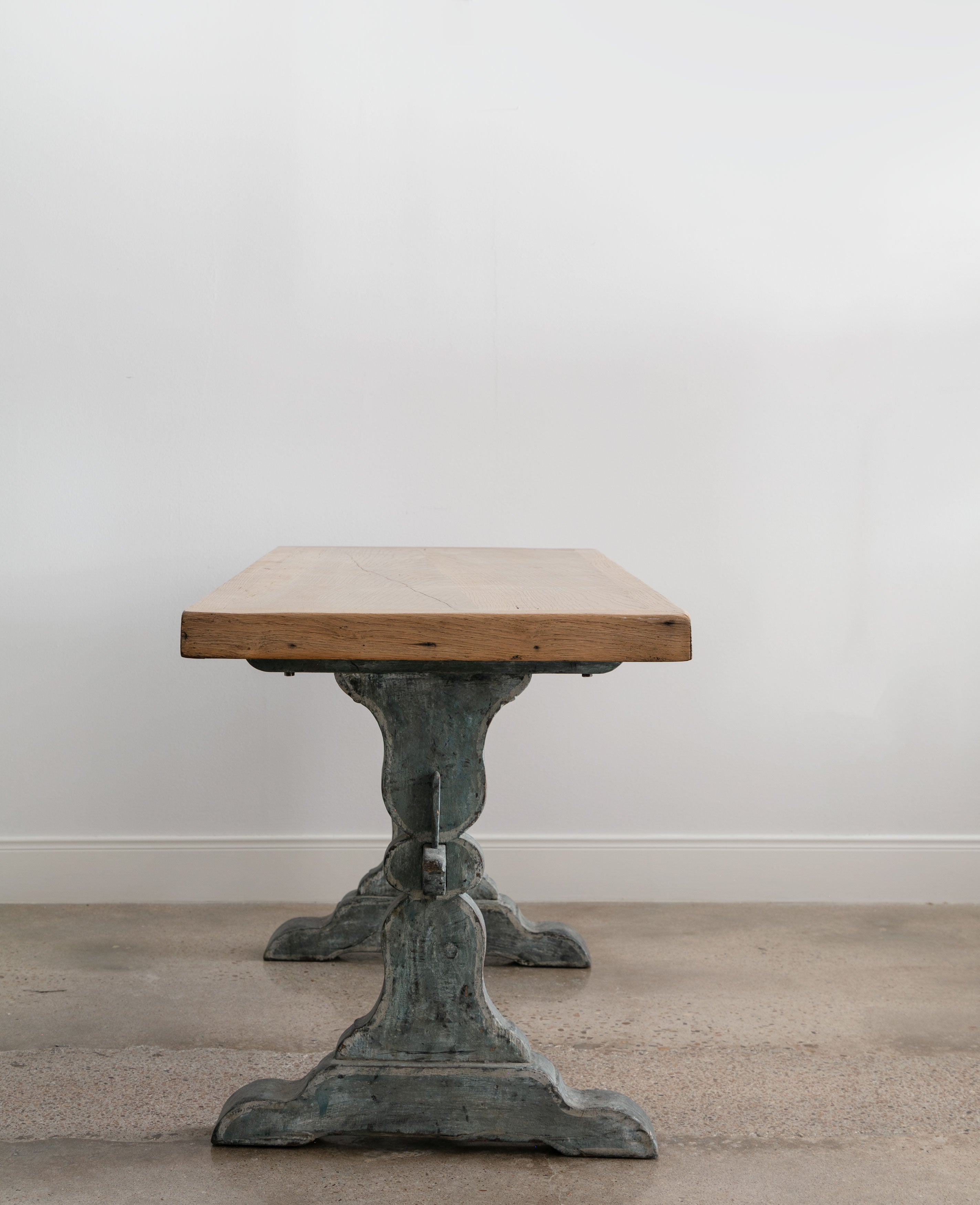 front end view of antique trestle table, blue base