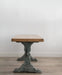 front end view of antique trestle table, blue base