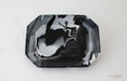 Black marbled ceramic tray on a white background