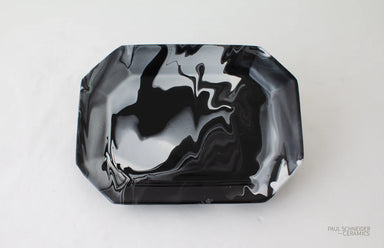 Black marbled ceramic tray on a white background