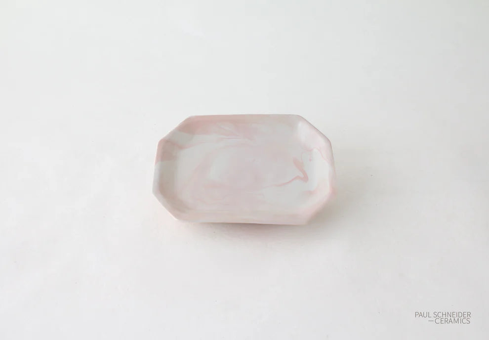 Pink ceramic dish on a white background