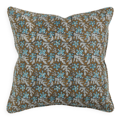 Decorative pillow with floral pattern on brown background