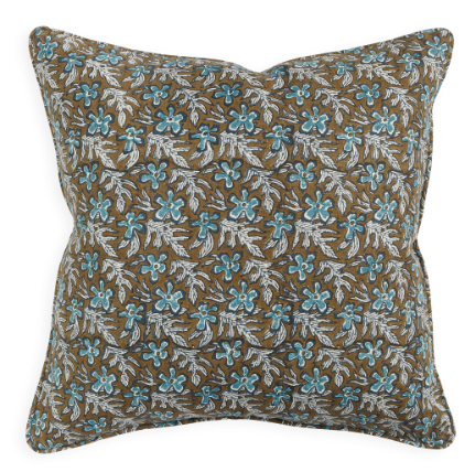 Decorative pillow with floral pattern on brown background