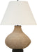 Table lamp with woven base and white shade on a white background