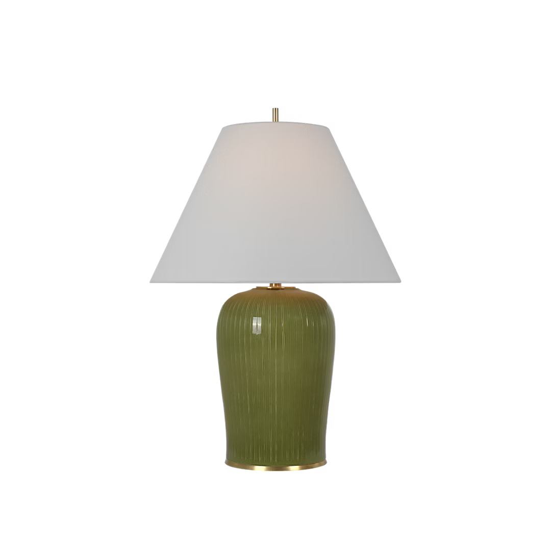 Green table lamp with a white shade on a white background