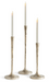 Three textured metallic candlesticks with flared bases, each holding a white taper candle, shown on a clean white background.