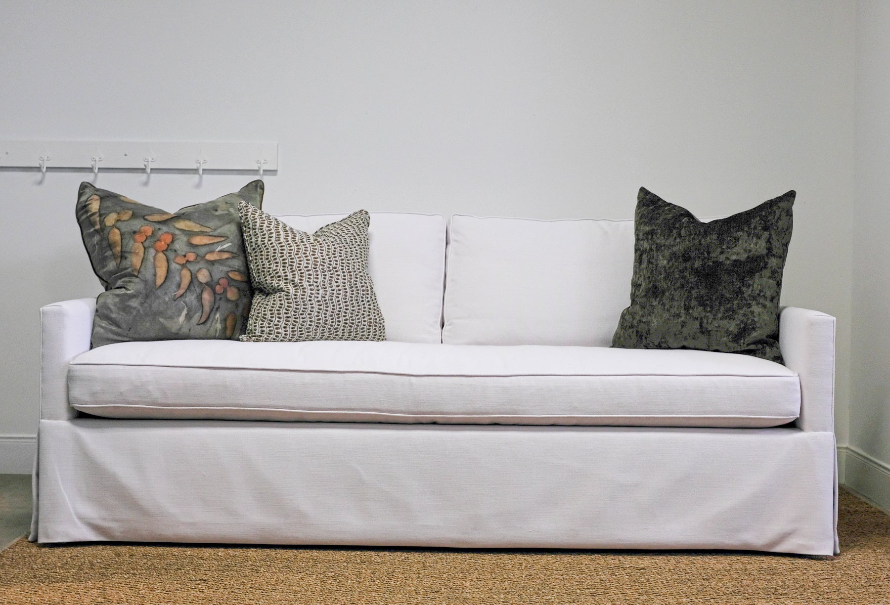 white sofa with grey pillows