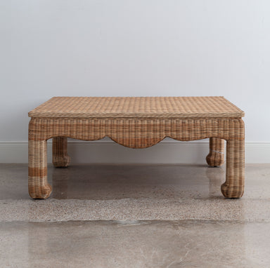 wicker coffee table with curved apron and Asian-influenced style legs