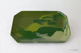 Green ceramic tray on a white background