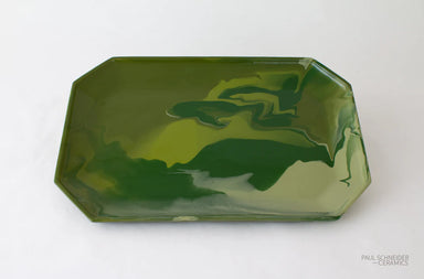 Green ceramic tray on a white background