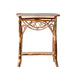 Wicker side table with woven design on a white background