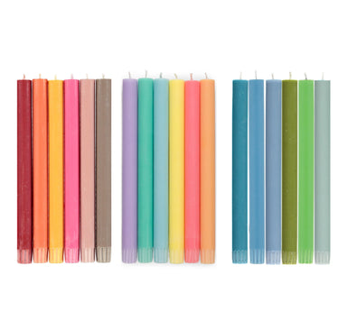 Set of colorful candles in various shades on a white background
