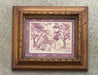 A framed art print featuring a sepia-toned landscape scene with trees and figures, surrounded by purple borders and an ornate brown wooden frame, mounted on a textured gray wall.