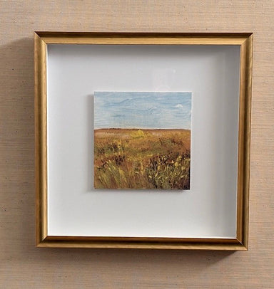gold framed landscape with wheat and sky