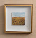 gold framed landscape with wheat and sky