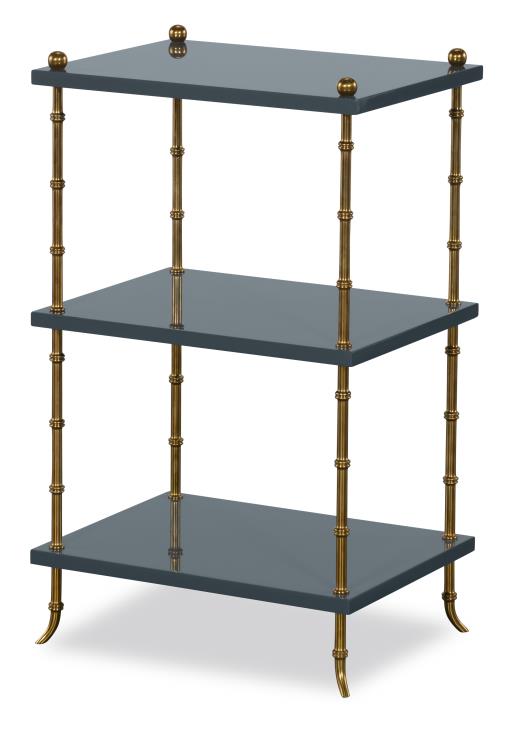 Three-tiered shelf with brass accents on a white background