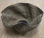 Woven basket with a geometric pattern on a beige surface