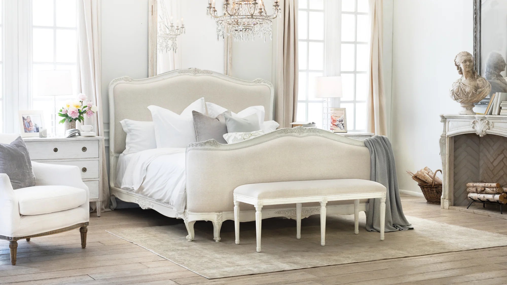 Neatly arranged bedroom with a bed, chair, and bench.