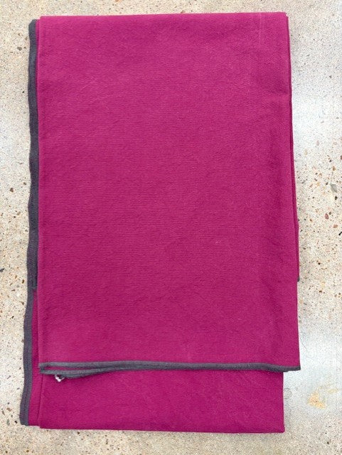 berry colored towel with gray border on a light gray background