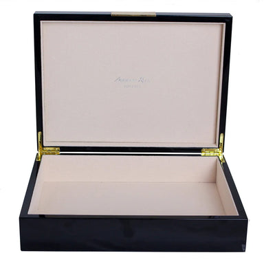 Black wooden jewelry box with beige interior on a white background