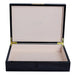 Black wooden jewelry box with beige interior on a white background