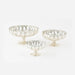 Set of three mercury glass pedestal bowls on a white background