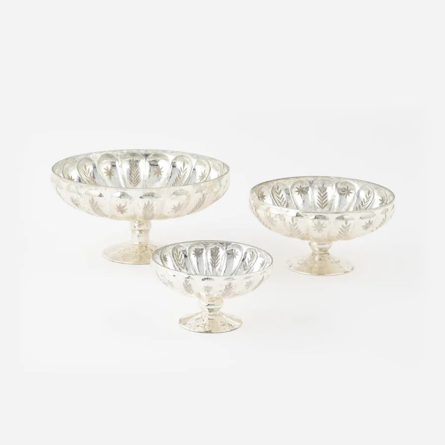 Set of three mercury glass pedestal bowls on a white background
