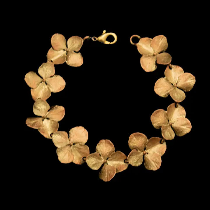 Bracelet made of dried hydrangea flowers on a black background