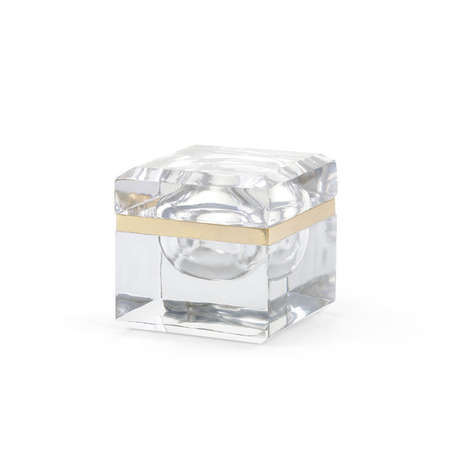 Clear cube-shaped glass box with gold accent on a white background